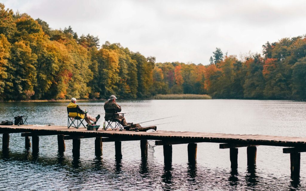 Fishing from a pier on a fall day